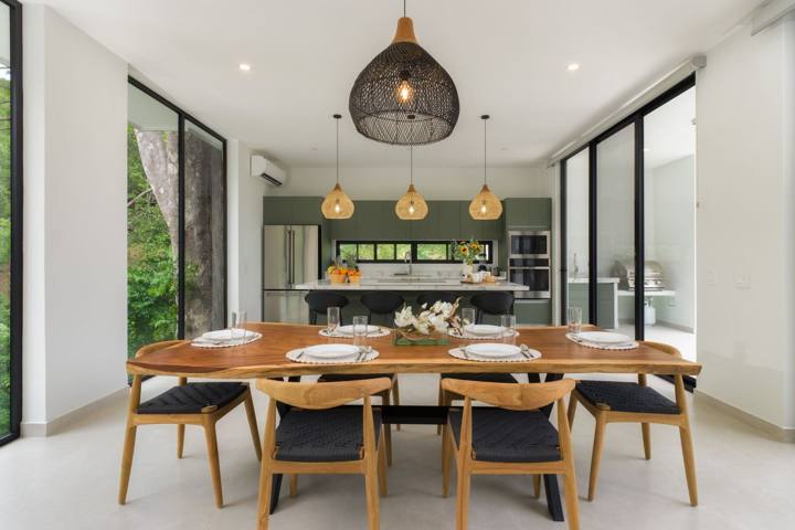 Live-edge dining table for eight in front of the kitchen